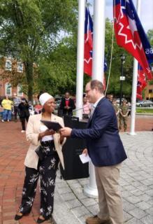 Presenting a City Seal at the 2023 Juneteenth Flag Raising event
