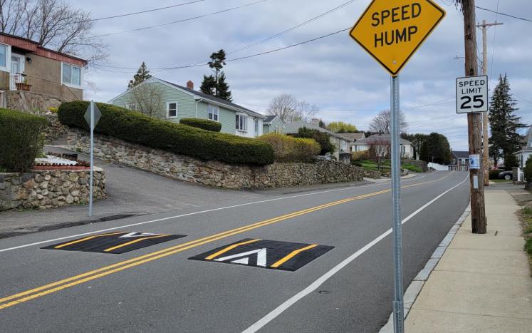 Speed cushions on Valley Street in Salem with sign that says "Speed Hump"